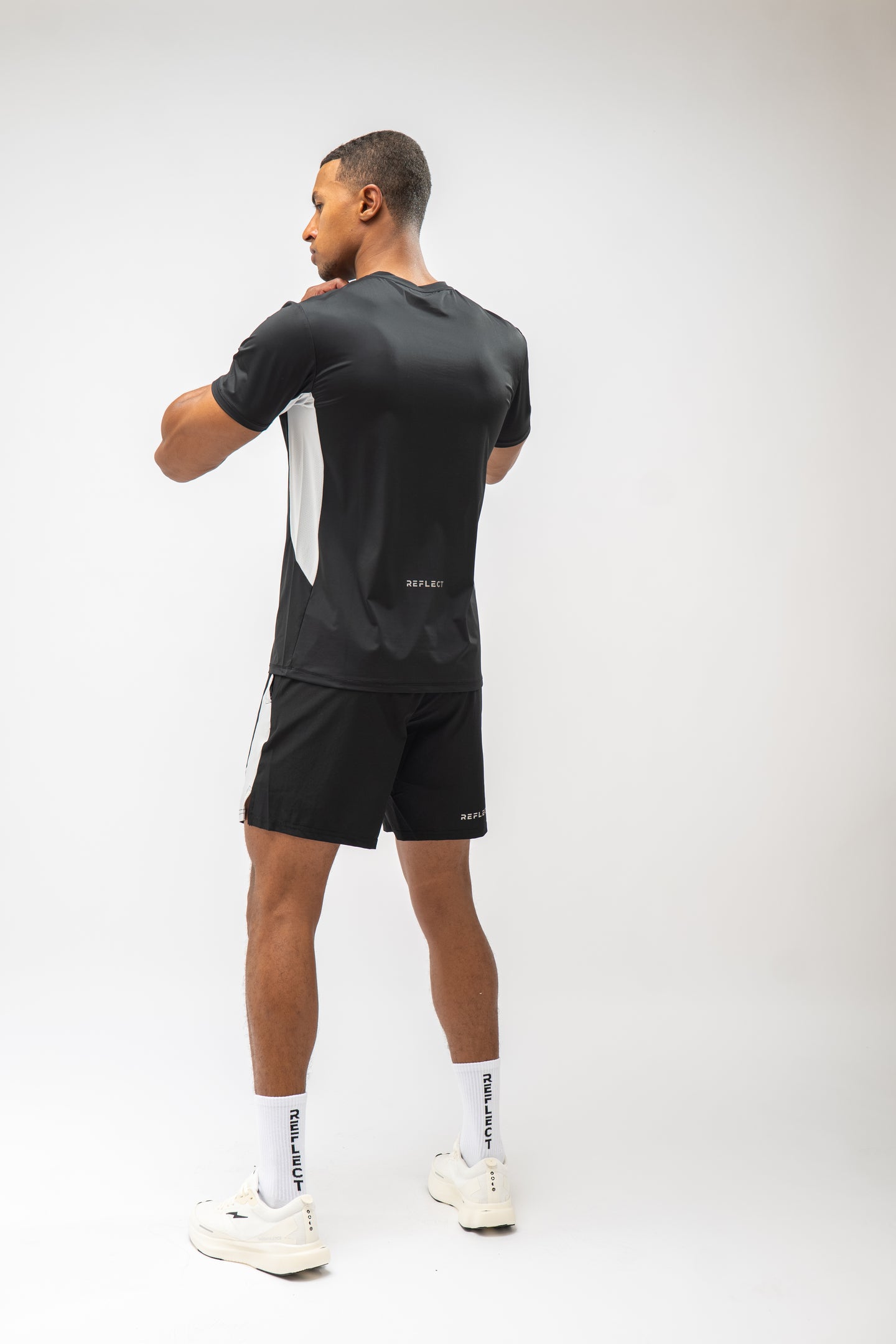 Model wearing Reflect® training kit in black — lifestyle