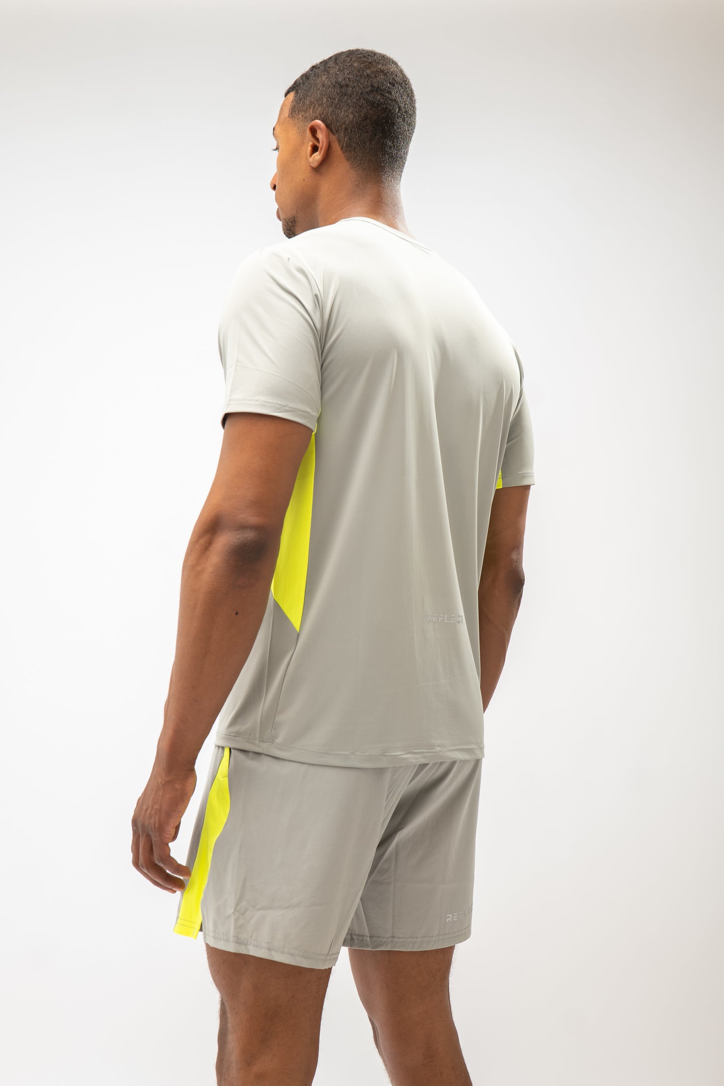 Model wearing Reflect® training kit in grey — lifestyle