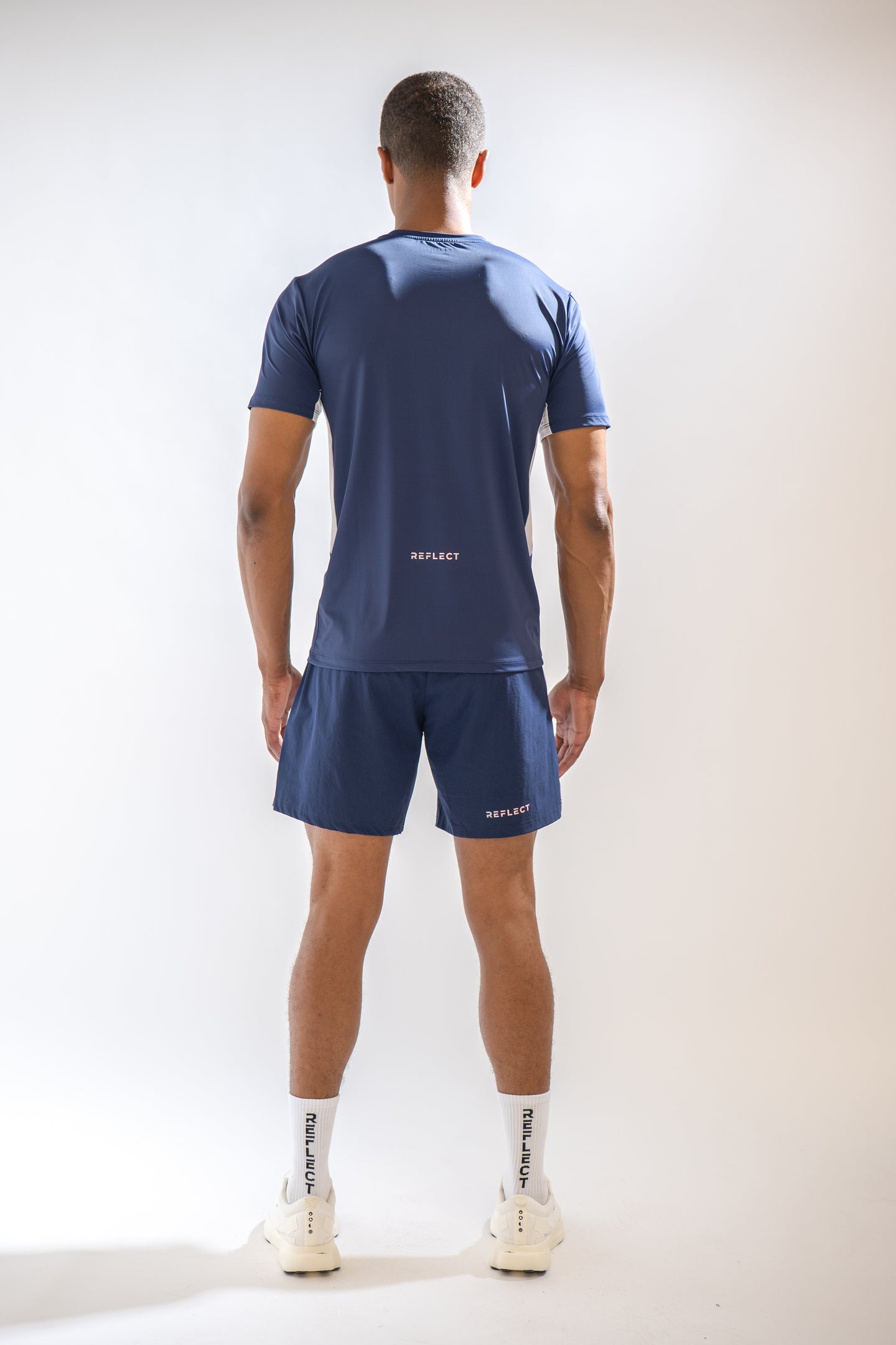 Model wearing Reflect® training kit in blue — lifestyle