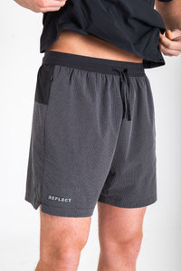 Reflect® Mesh Running Shorts worn on model — lifestyle