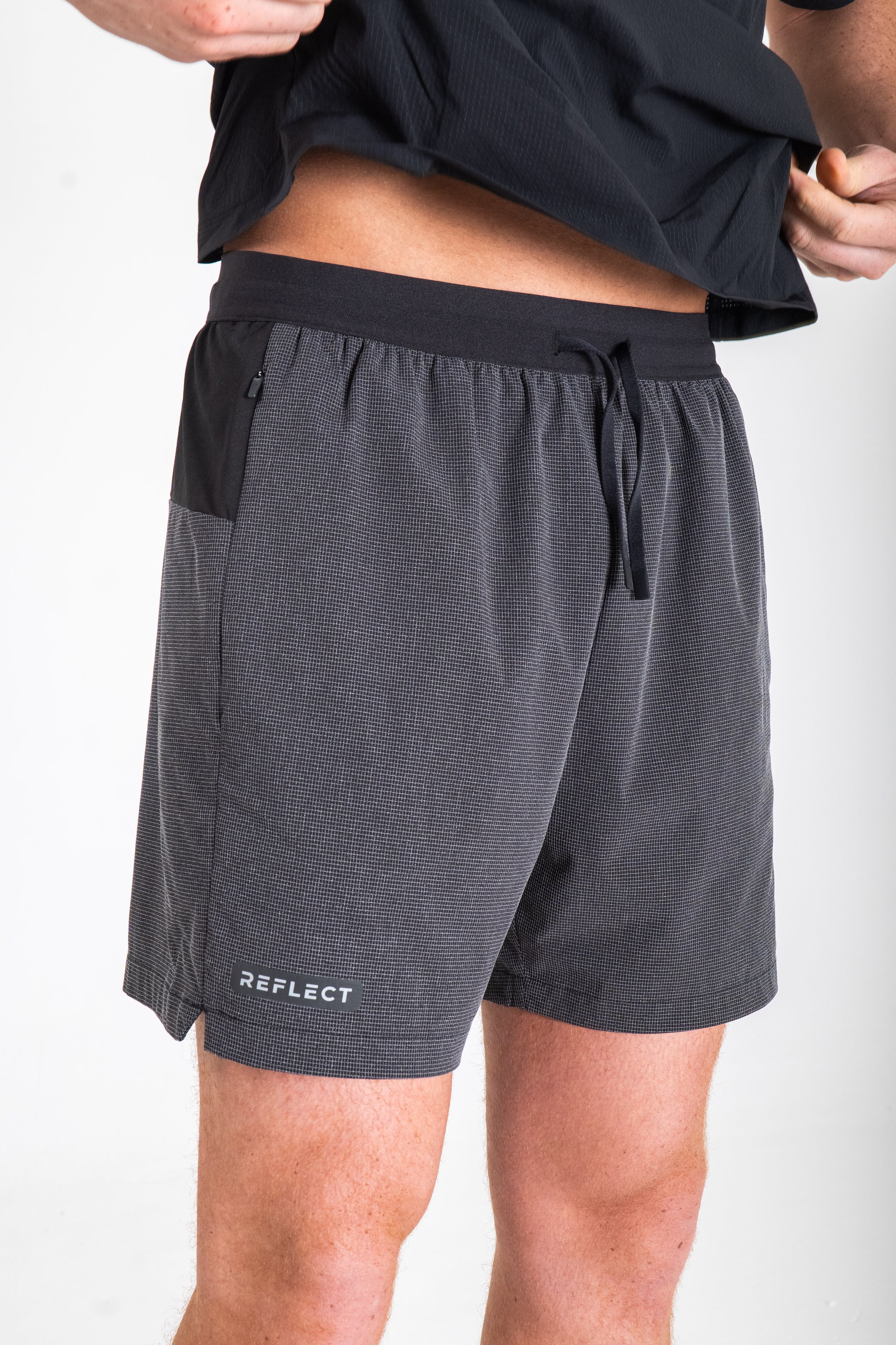Reflect® Mesh Running Shorts worn on model — lifestyle