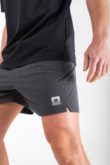 Reflect® Mesh Running Shorts — reflective branding detail