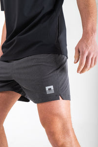 Reflect® Mesh Running Shorts — reflective branding detail